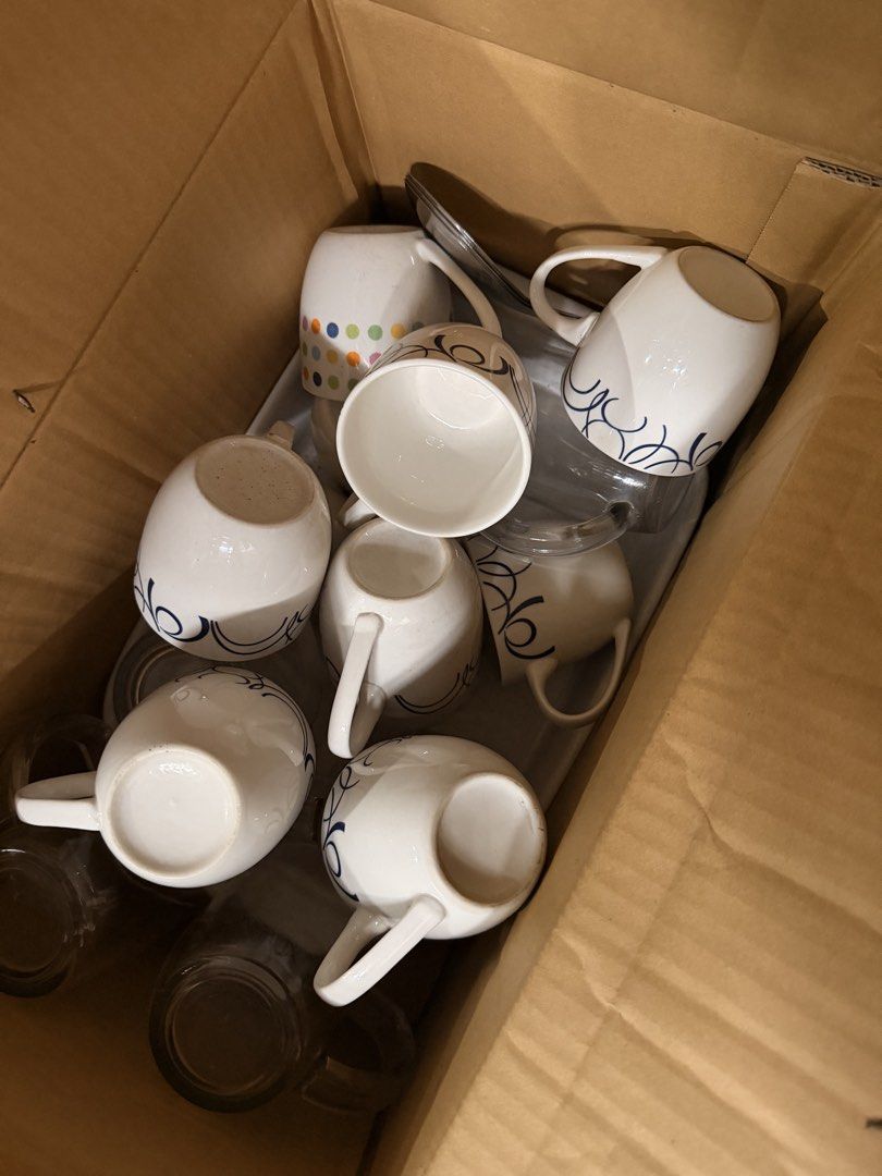 Set of White Ceramic Mugs with Blue Swirl Pattern (Category: Coffee & Tea Tableware) located in Quezon City. Submitted by shop.leilou (Listing ID 1467458080, Image 2). Description: - Assorted mug set, 7pcs available - Includes white ceramic mugs with blue swirls - 1 fun colorful dotted mug - Several clear glass mugs included - Perfect for coffee, tea, or daily use RFS: Clearing out extra kitchen items.