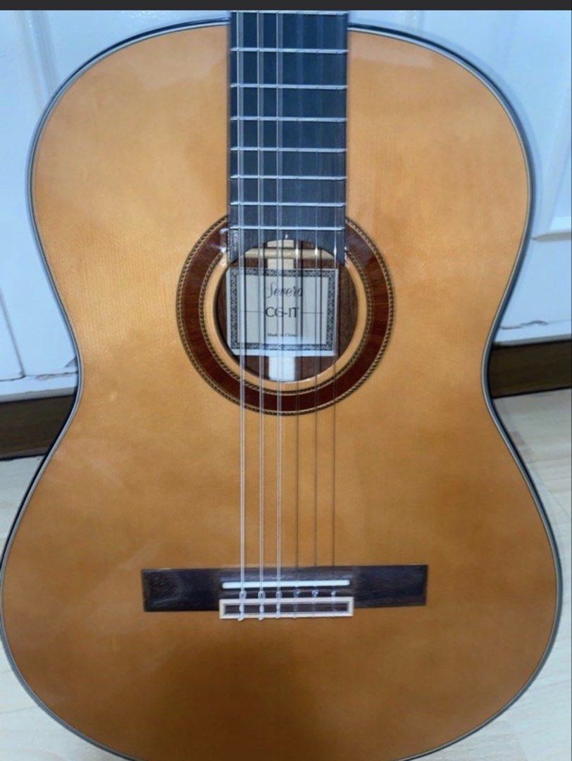 Severo CG-1T Classical Guitar (Category: Musical Instruments) located in Angeles City. Submitted by closetby3girls (Listing ID 1467397720, Image 2). Description: - Model: Severo CG-1T classical guitar - Strings: Nylon strings with a clean fretboard and top wood - Design: Traditional rosette soundhole and black headstock with gold tuners - Included: Padded brown gig bag with Severo logo - Ideal for: Students and casual players looking for a reliab