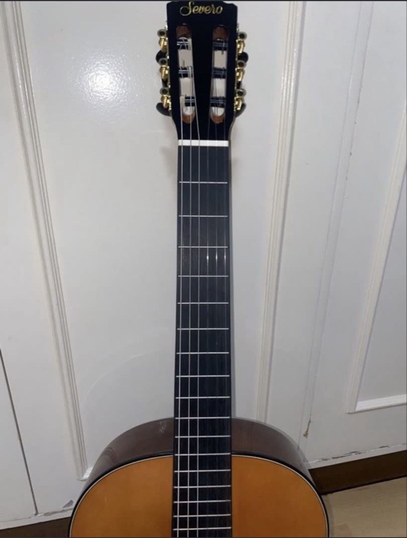 Severo CG-1T Classical Guitar (Category: Musical Instruments) located in Angeles City. Submitted by closetby3girls (Listing ID 1467397720, Image 3). Description: - Model: Severo CG-1T classical guitar - Strings: Nylon strings with a clean fretboard and top wood - Design: Traditional rosette soundhole and black headstock with gold tuners - Included: Padded brown gig bag with Severo logo - Ideal for: Students and casual players looking for a reliab