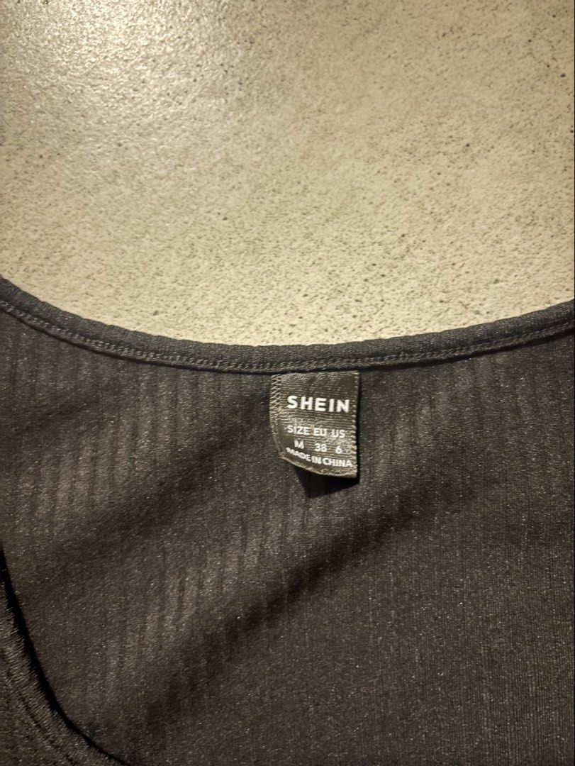 SHEIN Black Square Neck Button Front Top Size M (Category: Blouses) located in Manila. Submitted by nicoleaaa (Listing ID 1467454963, Image 3). Description: - Brand: SHEIN - Color: Black - Size: Medium - Style: Short-sleeve top with square neckline and decorative front buttons - Material: Textured fabric - Measurements: ~18" pit-to-pit, ~19" length - Condition: Excellent.