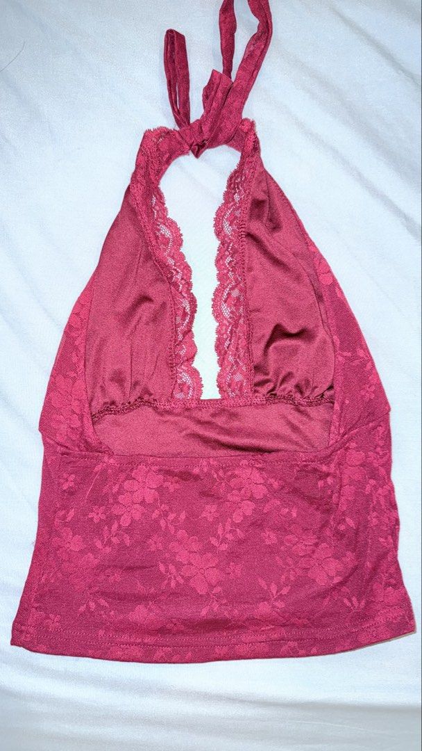 SHEIN Burgundy Lace Halter Top (Category: Sleeveless) located in Las Pinas. Submitted by kathhsantoss (Listing ID 1467498622, Image 2). Description: - Used only once - Measurements: Bust - 34.6in Waist - 24.8in Length - 18.5in - Material: 100% lightweight polyester - Design: Deep V-neckline with all-over floral lace trim, open back, and adjustable tie neck closure .