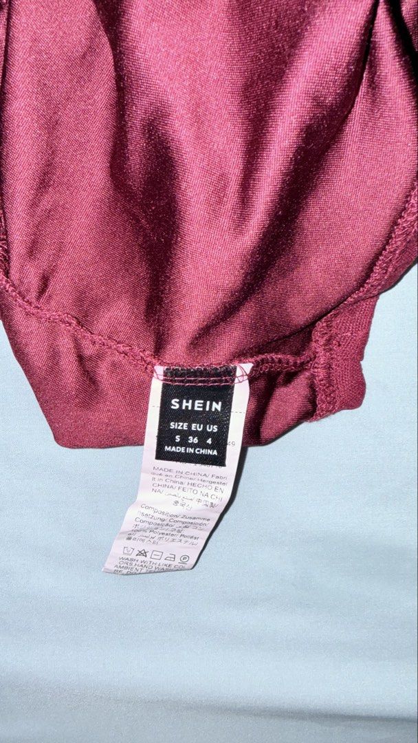 SHEIN Burgundy Lace Halter Top (Category: Sleeveless) located in Las Pinas. Submitted by kathhsantoss (Listing ID 1467498622, Image 3). Description: - Used only once - Measurements: Bust - 34.6in Waist - 24.8in Length - 18.5in - Material: 100% lightweight polyester - Design: Deep V-neckline with all-over floral lace trim, open back, and adjustable tie neck closure .