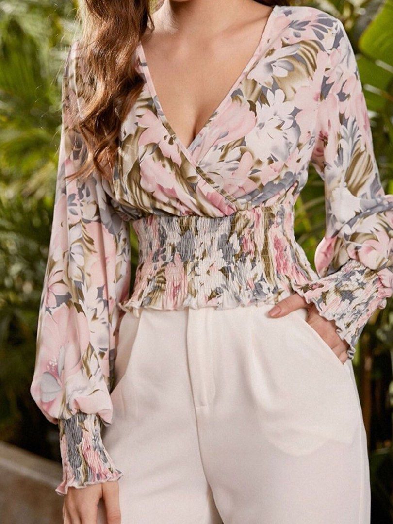 SHEIN Floral Print Wrap Crop Blouse (Category: Blouses) located in Malabon City. Submitted by ajaasmith (Listing ID 1467395975, Image 1). Description: - Brand: SHEIN - Size: US 4 - Condition: Worn once, like new - Design: Pink, green, and blue floral pattern - Style: V-neck wrap top with long sleeves, smocked waist, and smocked cuffs - Fabric: Super lightweight and comfortable Php 120.