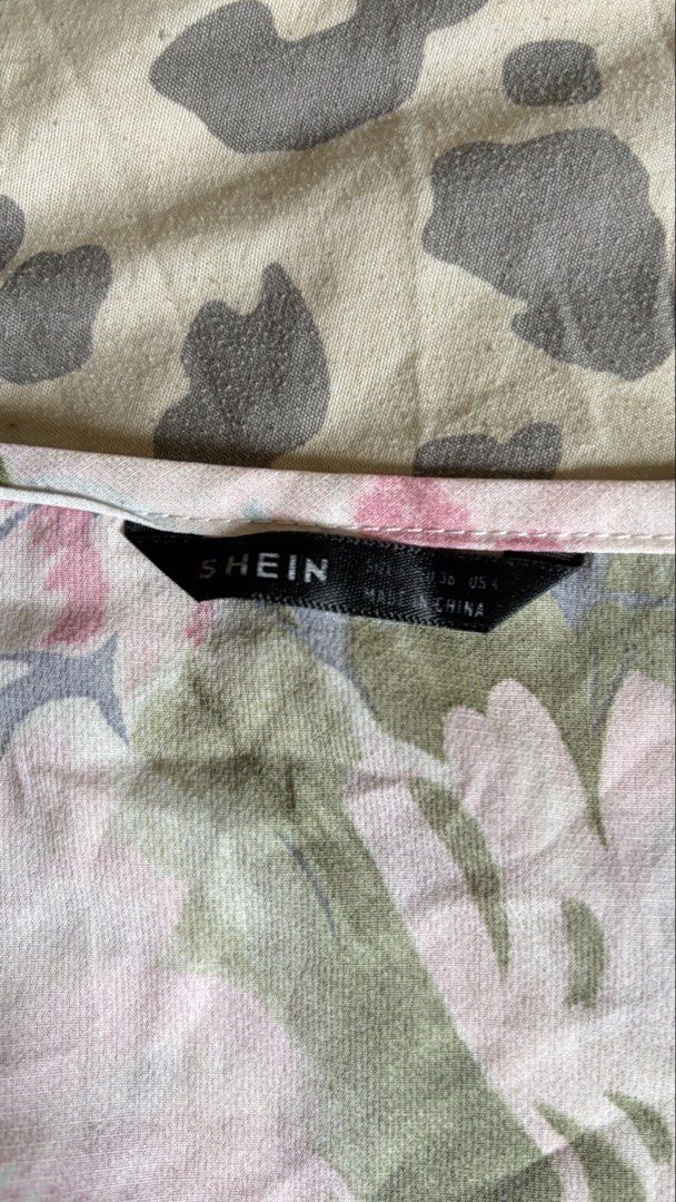 SHEIN Floral Print Wrap Crop Blouse (Category: Blouses) located in Malabon City. Submitted by ajaasmith (Listing ID 1467395975, Image 3). Description: - Brand: SHEIN - Size: US 4 - Condition: Worn once, like new - Design: Pink, green, and blue floral pattern - Style: V-neck wrap top with long sleeves, smocked waist, and smocked cuffs - Fabric: Super lightweight and comfortable Php 120.