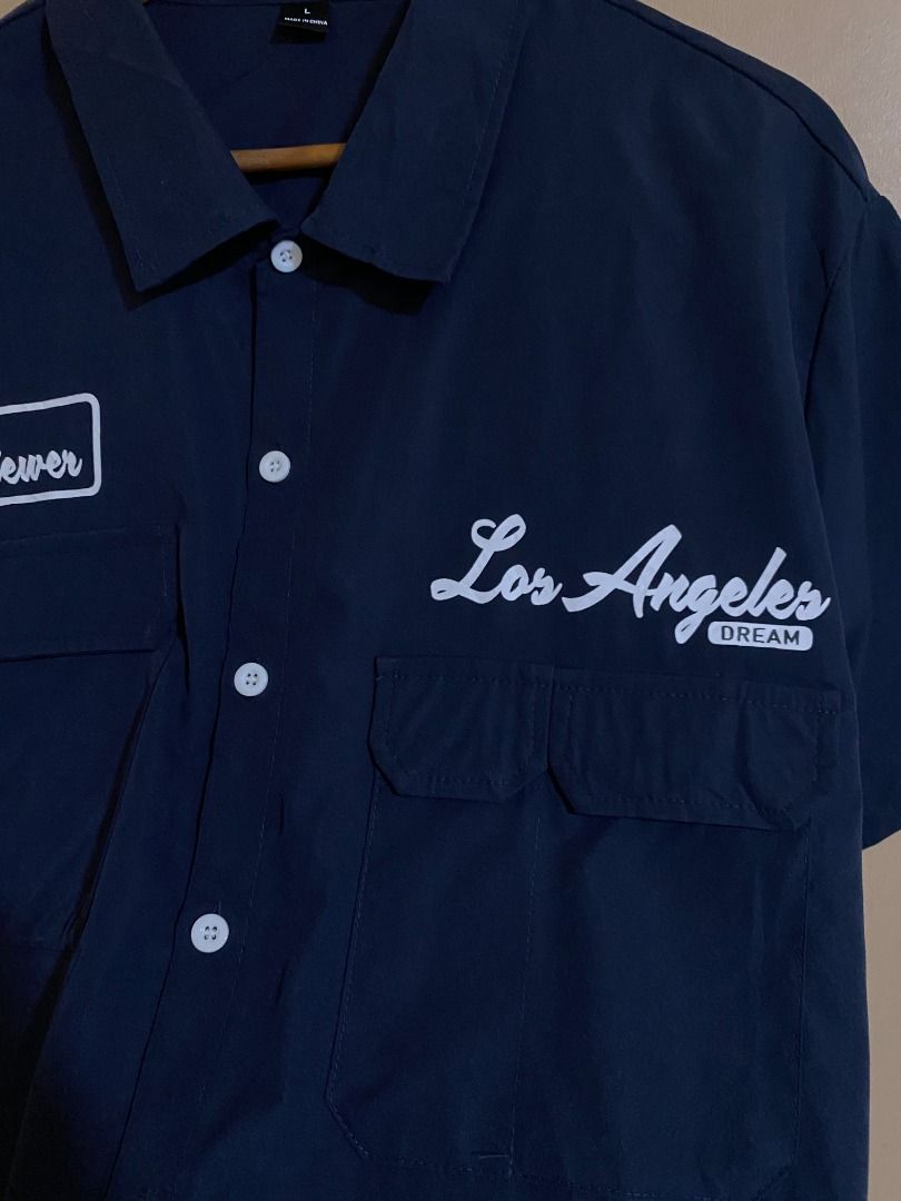SHEIN Navy Button Up Multi Pocket Polo (Category: Tshirts & Polo Shirts ) located in Cadiz. Submitted by thespotcdz (Listing ID 1467399032, Image 2). Description: Fits XL Width 23.5" Length 30" Good as new.