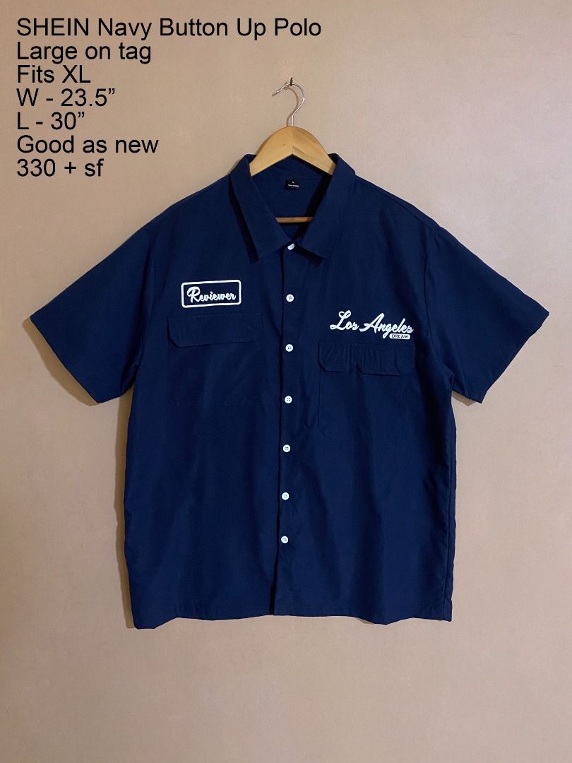 SHEIN Navy Button Up Multi Pocket Polo (Category: Tshirts & Polo Shirts ) located in Cadiz. Submitted by thespotcdz (Listing ID 1467399032, Image 1). Description: Fits XL Width 23.5" Length 30" Good as new.