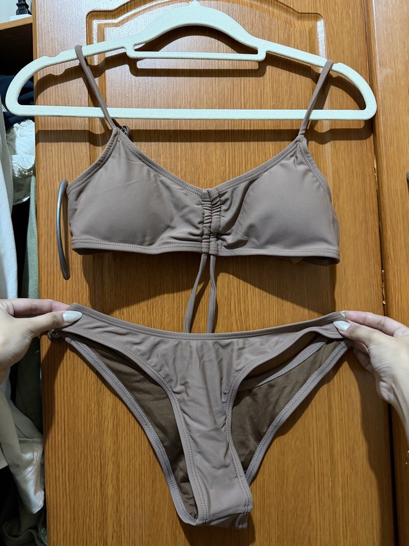 Shein Nude Two-Piece Bikini Set Swimwear (Category: Bikinis & Swimsuits) located in Muntinlupa City. Submitted by biancaagbscloset (Listing ID 1467576749, Image 1). Description: - Style: Nude two-piece bikini set - Top: Adjustable thin straps, padded cups, and gathered center front tie detail - Bottoms: Low-rise fit with stylish double-strap side accents and contrast lining - Condition: Clean fabric, no stains, flaws, or visible wear - Perfect fo