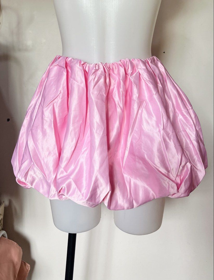 SHEIN Pink Satin Bubble Skirt Size S (Category: Skirts) located in Manila. Submitted by serendipity.findss (Listing ID 1467435017, Image 1). Description: - Brand/Style: SHEIN bright pink satin bubble skirt - Size: Small (US 4, EU 36) - Material: 100% smooth polyester satin - Fit: Comfortable elastic waistband with a puffy, voluminous silhouette - Versatility: Perfect for festivals, parties, and trendy streetwear looks - Condition: Excellent/Brand