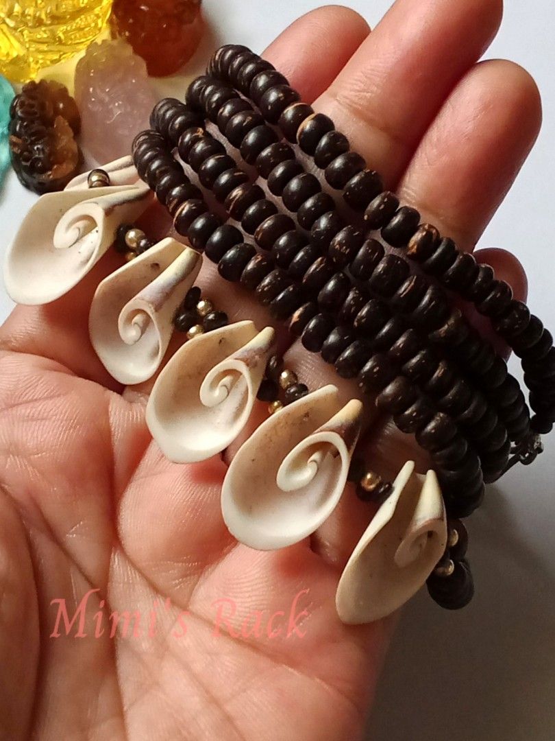 Shell and Wood Necklace (Category: Necklaces) located in Taguig. Submitted by mimisrack (Listing ID 1467436988, Image 3). Description: 🤎🐚A unique statement necklace featuring natural-looking dark wooden beads paired with beautiful cream and beige carved shell pendants. ✨ The intricate spiral designs add an artistic, earthy charm, while the gold-tone accent beads give it a subtle touch of elegance. 🧿 wood beads: 5mm 🧿 shell size: 12mm 🧿 neckl