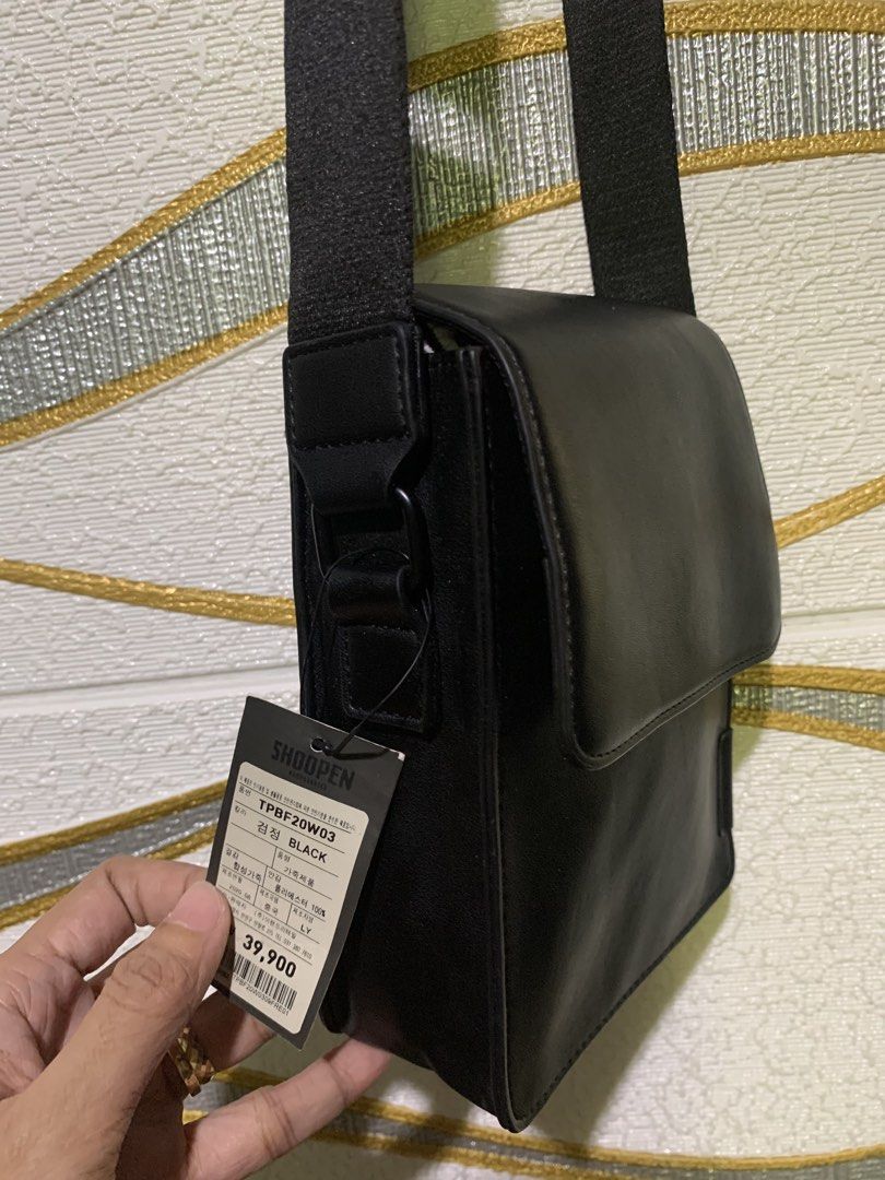 Shoopen Crossbody Bag TPBF20W03 Black (Category: Cross-body Bags) located in Carigara. Submitted by spark2503 (Listing ID 1467383509, Image 2). Description: - Brand: Shoopen - Model: TPBF20W03 - Color: Classic Black - Material: Synthetic leather with polyester lining - Closure: Flap with secure magnetic snap - Strap: Adjustable fabric shoulder strap - Condition: Brand new with original tag still attached.