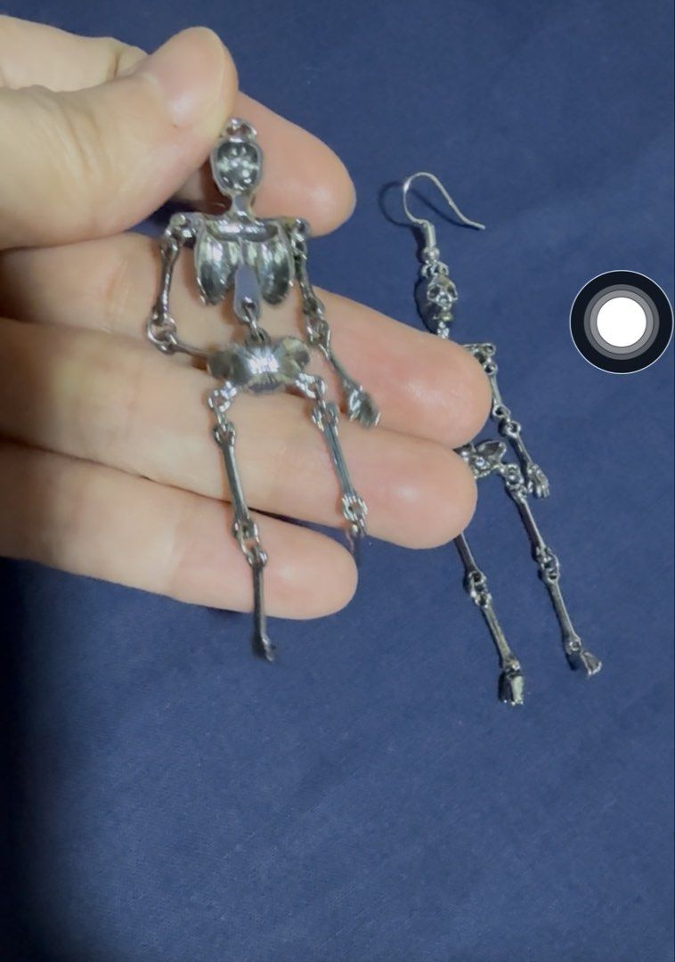 Silver Skeleton Dangle Earrings Holloween Gothic (Category: Earrings) located in Quezon City. Submitted by anille (Listing ID 1467570212, Image 3). Description: - Design: Detailed silver skeleton with moving arms and legs - Closure: Easy-to-wear hook style - Comfort: Lightweight for all-day wear - Style: Perfect statement piece for holloween or gothic outfits.