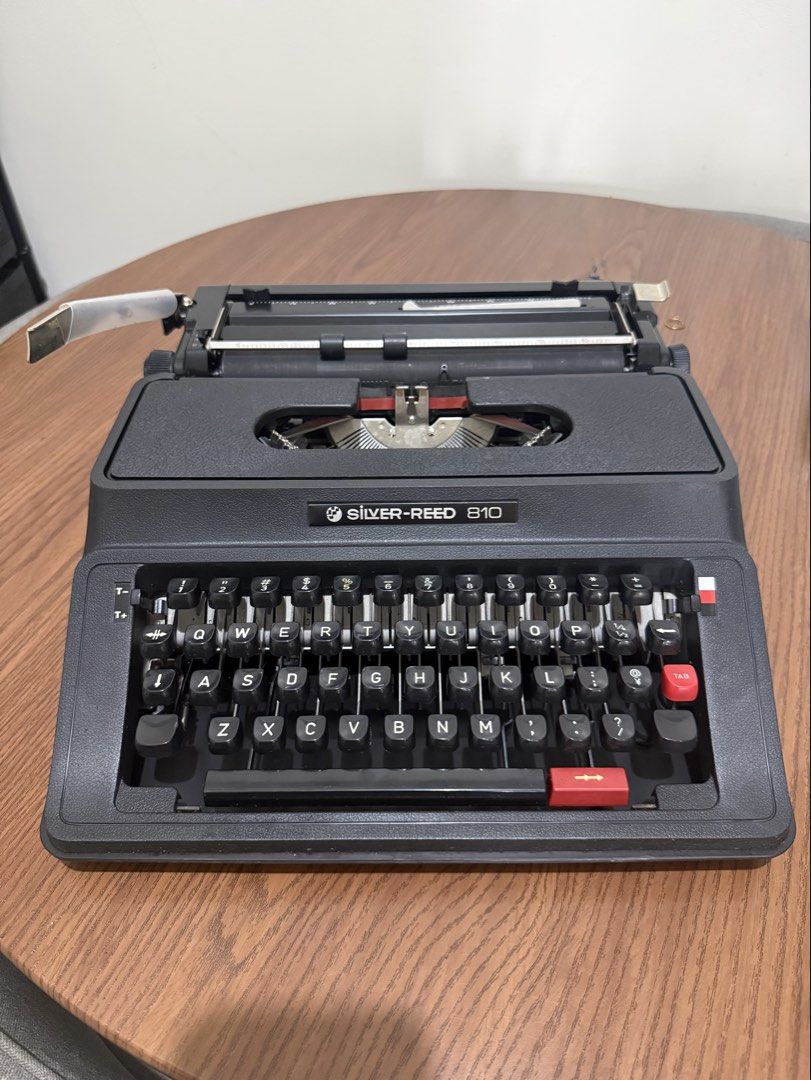 Silver-Reed 810 Typewriter (Category: Office & Business Technology) located in Taguig. Submitted by baghabitmnl (Listing ID 1466477336, Image 1). Description: - Brand/Model: Silver-Reed 810 Manual Typewriter - Color: Classic black with white lettering - Keyboard: Standard QWERTY layout - Condition: Fully functional, well-maintained mechanical parts - Inclusions: Matching black hard protective case with carrying handle - Perfect for: Creative writ