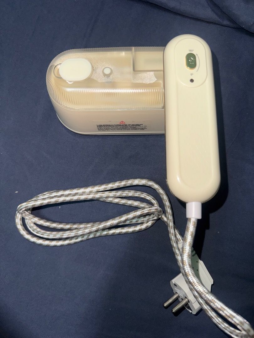 Simplus 2 in 1 Steam Iron GTJH022 (Category: Irons & Steamers) located in Makati City. Submitted by reveblinkqueue (Listing ID 1467566833, Image 3). Description: - Model: Simplus 2-in-1 Steam Iron and Garment Steamer - Color: Cream White - Function: Supports both wet and dry ironing - Design: Portable size with a convenient foldable handle, great for travel and home storage - Capacity: 140ml water tank - Cord: Durable woven patterned finish with 