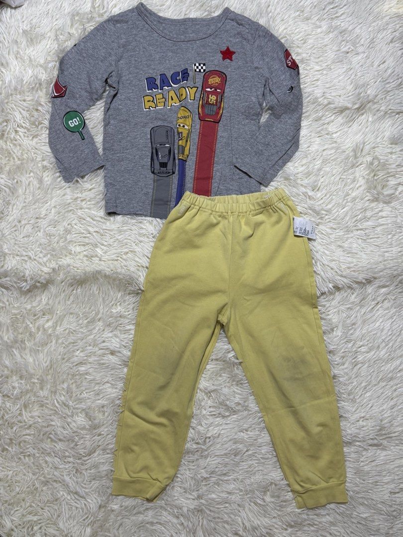 sleepwear kids (Category: Babies & Kids Fashion) located in Dagupan City. Submitted by iamrannflores (Listing ID 1467419440, Image 1). Description: - Brand: Uniqlo - Design: Disney Pixar Cars (Lightning McQueen graphic) - Set includes: 1 Grey long sleeve top and 1 Yellow jogger pants - Size: 100 (Fits height 100cm, weight 16kg) - Material: Soft and comfortable cotton blend - Features: Easy pull-on style joggers with elastic waistband bawal sa mas