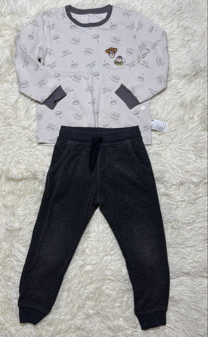 sleepwear kids (Category: Babies & Kids Fashion) located in Dagupan City. Submitted by iamrannflores (Listing ID 1467419645, Image 1). Description: - Set includes: Uniqlo Disney Pixar Toy Story top and George grey fleece joggers - Top: Size 110 (fits height 110cm, weight 19kg), cotton-polyester blend, features all-over print and Woody & Buzz pocket patch - Joggers: Size XS/TP (4-5 years), 100% polyester fleece with an adjustable drawstring waist 