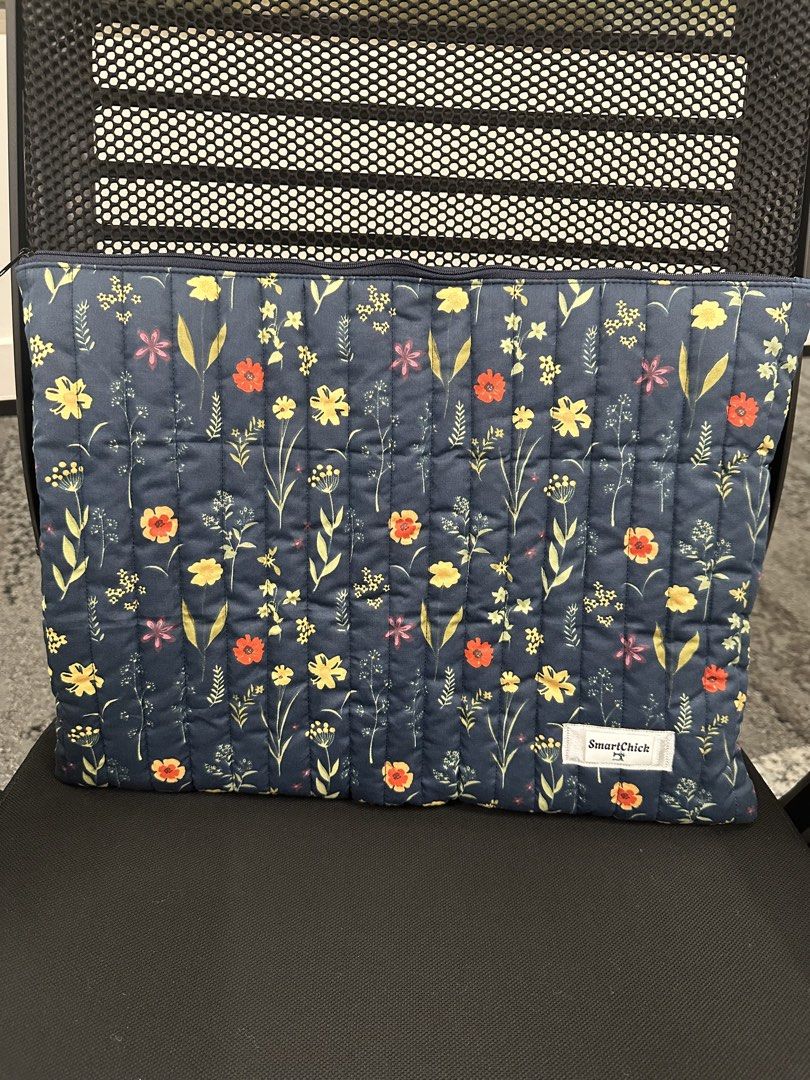 SmartChick Quilted Floral 16-17” Laptop Pouch (Category: Laptop Bags & Sleeves) located in Malabon City. Submitted by vanic (Listing ID 1467469358, Image 1). Description: - Brand: SmartChick - Design: Dark blue with vibrant yellow and orange floral print - Material: Soft quilted texture for extra item protection - Closure: Secure top zipper - Condition: Brand new/Excellent.