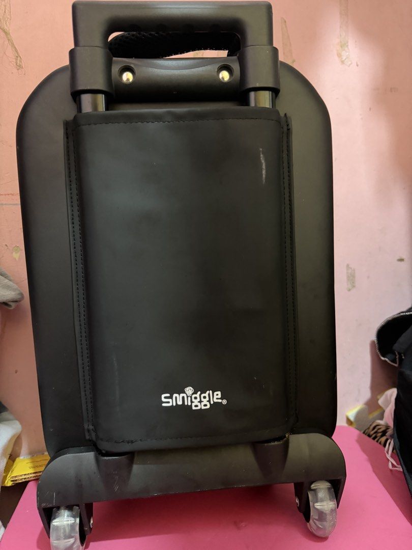 Smiggle Unicorn Cat Hard Shell Rolling Luggage Suitcase (Category: Luggage) located in Manila. Submitted by shielamar05615 (Listing ID 1467372464, Image 3). Description: - Authentic Smiggle rolling suitcase in classic black - Adorable raised purple unicorn cat design with a rainbow horn, colourful mane, and stars - Features a smooth telescopic handle and sturdy bottom wheels for easy travel - Secure side zip closure and convenient back pocket fla