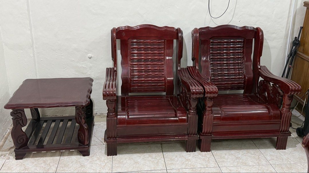 Malaysian Solid Wood Sala set / Sofa and Table Set (Category: Sofas) located in Valenzuela. Submitted by missp22 (Listing ID 1467420035, Image 3). Description: - Complete solid wood living room furniture set in rich dark mahogany finish - Includes 1 large 3-seater sofa and 2 matching single armchairs with comfortable slat-style backrests and seats - Matching furniture includes 1 coffee table with lower slatted shelf and 1 small side table - Heavy