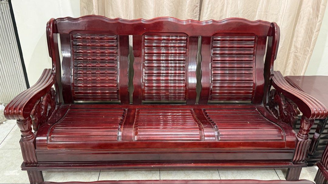 Malaysian Solid Wood Sala set / Sofa and Table Set (Category: Sofas) located in Valenzuela. Submitted by missp22 (Listing ID 1467420035, Image 2). Description: - Complete solid wood living room furniture set in rich dark mahogany finish - Includes 1 large 3-seater sofa and 2 matching single armchairs with comfortable slat-style backrests and seats - Matching furniture includes 1 coffee table with lower slatted shelf and 1 small side table - Heavy
