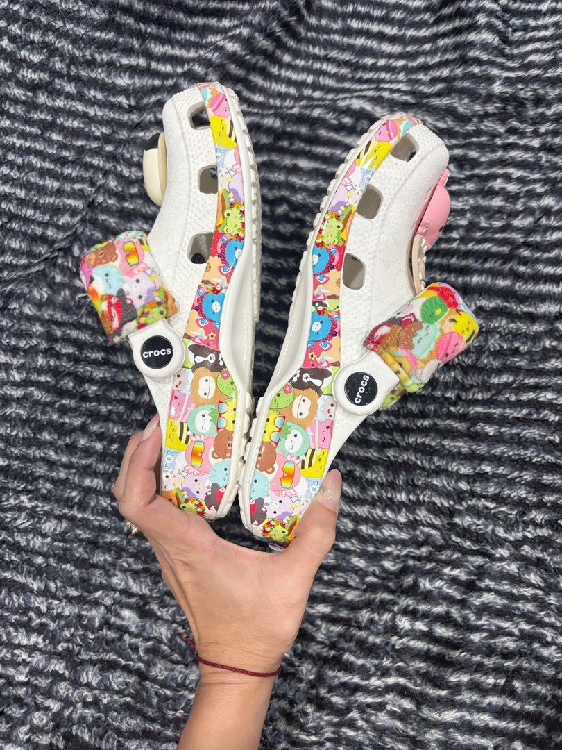 Squishmallows x Crocs Classic Clog White Multi (Category: Slippers and slides) located in Digos. Submitted by kathydiane76376 (Listing ID 1467518853, Image 2). Description: - Authentic Special Edition Squishmallows x Crocs collaboration - Color/Design: White base with vibrant all-over character print - Features cozy fuzzy heel straps covered in mini characters - Comes with cute pre-attached Jibbitz charms (cat, duck, ice cream designs) - Original