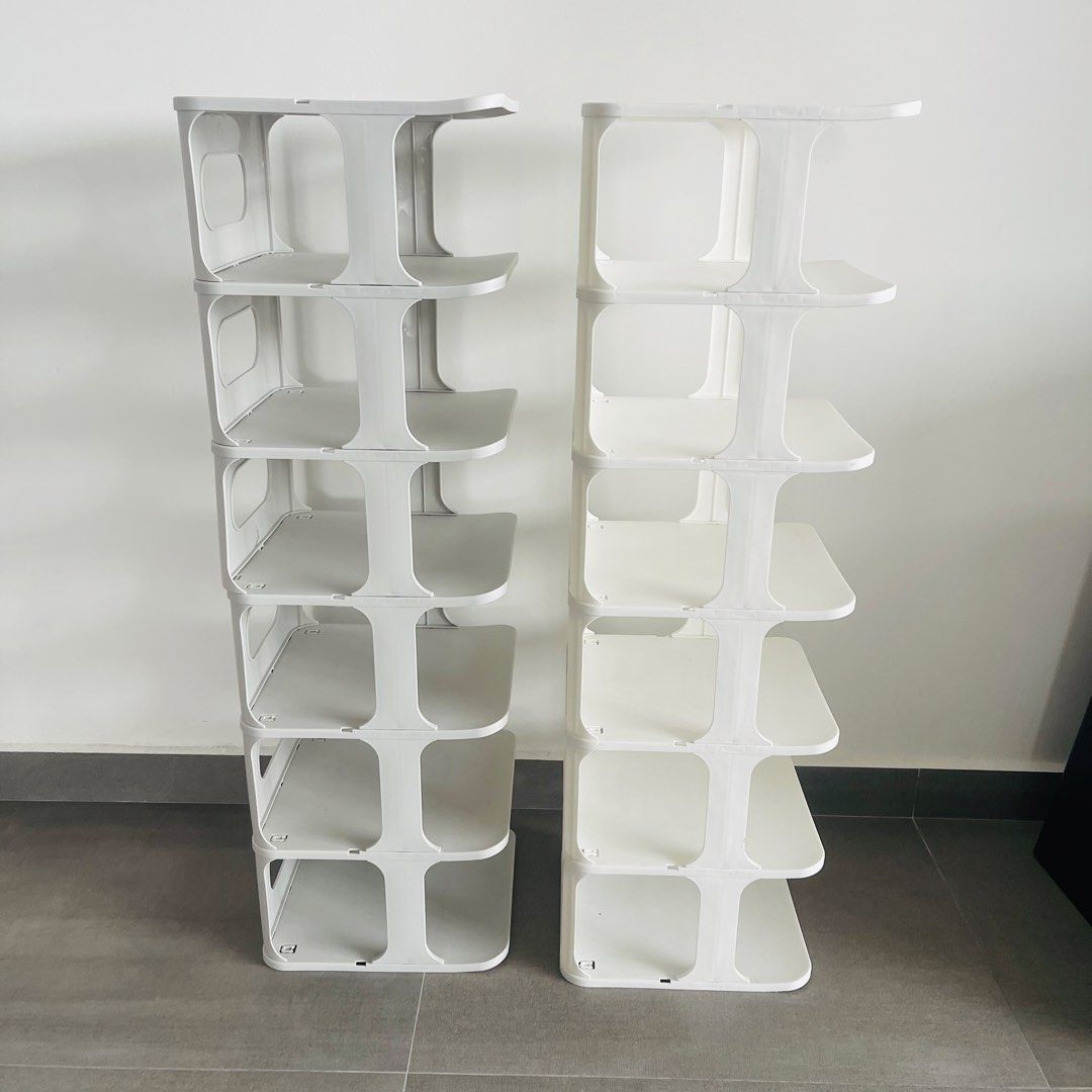 Stackable plastic shoe rack (Category: Shelves, Cabinets & Racks) located in Singapore. Submitted by apr1l (Listing ID 1467399366, Image 2). Description: Selling white at $7 Selling Grey at $6 Buy both for $10 - 2 shoe rack for sale - one White & one Grey - 7 tiers per rack for maximum entryway storage - Sturdy and reliable construction - Minor crack near the edge on grey rack at the back (shown in close-up photo) Condition: 9/10 Lightly used. Gr