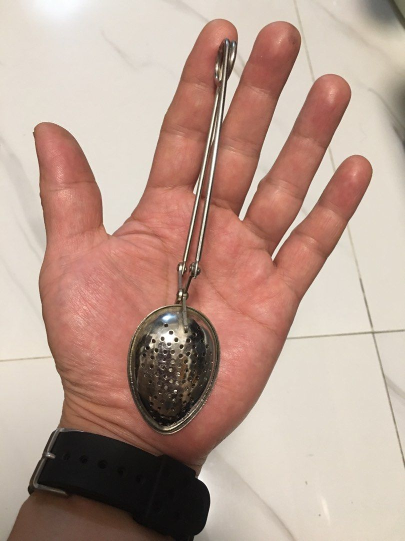 Stainless Steel Squeeze Handle Tea Infuser Spoon (Category: Coffee & Tea Tableware) located in Pasay City. Submitted by gilbertso62551 (Listing ID 1467471791, Image 1). Description: - Stainless steel tea infuser spoon - Long squeeze handles for easy opening - Perforated design ideal for loose leaf tea - Durable and handy tool for your daily brew - As is,where is - Not BrandNew - Good condition - NO COD/COP - NO FREE SHIPPING - PAYMENT FIRST - LOC