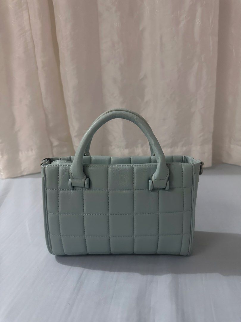 Steve Madden Quilted Light Blue Tote Handbag with Straps (Category: Tote Bags) located in Angeles City. Submitted by gonesellsolstorage (Listing ID 1467523596, Image 2). Description: - Brand: Steve Madden - Color: Light blue - Straps: Includes 2 interchangeable straps (matching faux leather + thick logo fabric strap with detachable mini pouch) - Interior: Clean lining with built-in compartments - Condition: Excellent / Well-maintained but has sta