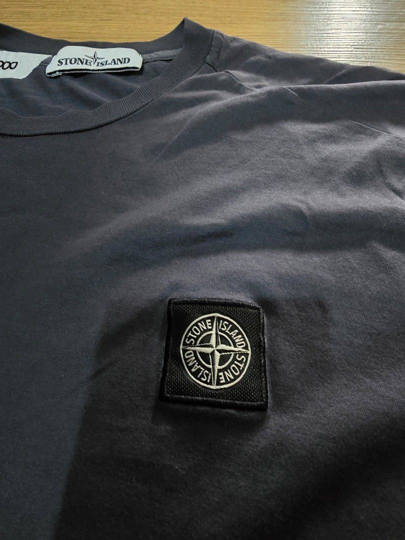 Stone Island Logo Patch T-Shirt Dark Grey Size M (Category: Tshirts & Polo Shirts ) located in Manila. Submitted by dunnohihi (Listing ID 1467368183, Image 2). Description: Stone Island crewneck t-shirt in dark grey. Features the signature compass patch embroidered on the chest. Size medium tag attached inside near the collar. Includes certilogo label showing authentication code CLG 195 220 169 592 with QR code. Soft cotton jersey fabric with sho