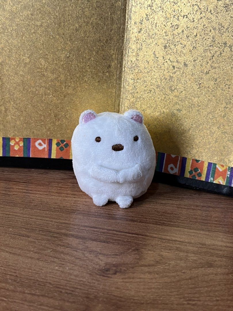 Sumikkogurashi Shirokuma Polar Bear Mini Plush (Category: Plushies & Soft Toys) located in Gapan. Submitted by lunashop14 (Listing ID 1467416236, Image 1). Description: - Authentic Sumikkogurashi Shirokuma plush toy with official San-X blue tush tag - Super soft white body with adorable pink sparkle inner ears - Detailed brown embroidered eyes, nose, little paws, and round tail - Compact palm size, perfect for display or collecting - Pristine, cl