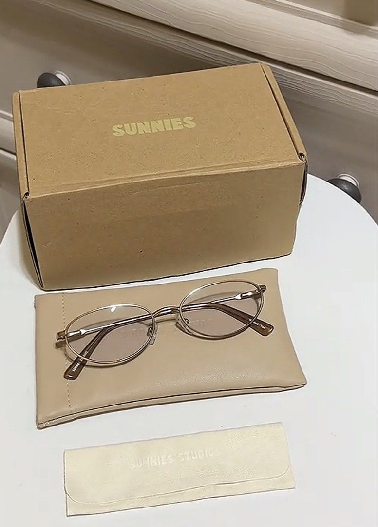 Sunnies Studios Marshall Tan Eyeglasses (Category: Sunglasses & Eyewear) located in Manila. Submitted by lilyblaire222 (Listing ID 1467445830, Image 1). Description: - Brand: Sunnies Studios - Model: Marshall - Color: Tan - Frame: Oval wire frame with clear lenses - Inclusions: pouch & cleaning cloth.