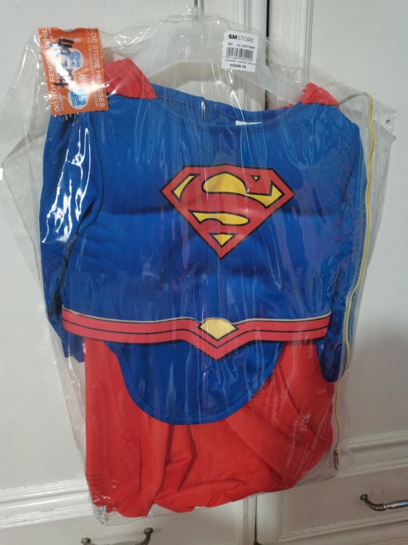 Superman Costume Kids (Category: Babies & Kids Fashion) located in Lucena. Submitted by jjbrandedcloset (Listing ID 1467381124, Image 1). Description: - Brand new, never opened or worn - Still sealed in original SM Store plastic wrapper - Original price tag of ₱2,299 attached - Includes blue top with classic red and yellow Superman logo - Attached red cape included - Features printed belt detail and matching red pants.