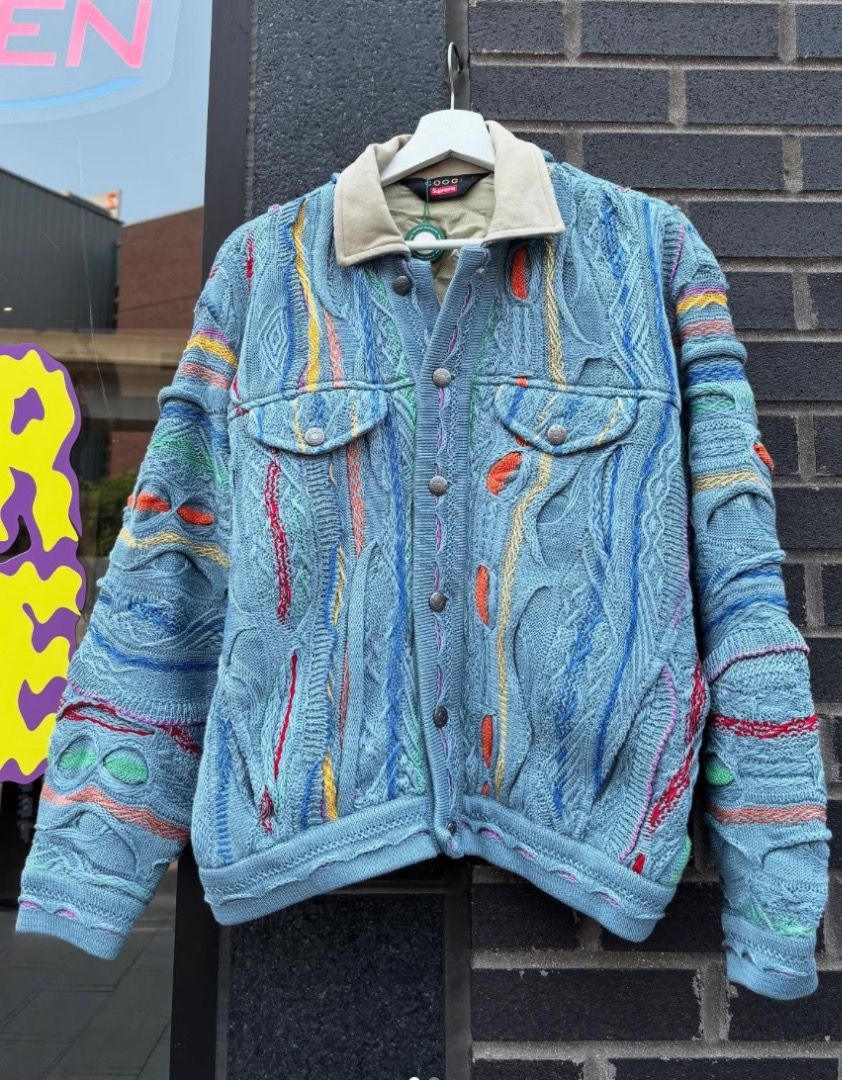 Supreme Coogi Trucker Jacket SS23 (Category: Luxury Apparel) located in San Pablo. Submitted by keentree.e10b73 (Listing ID 1467571008, Image 1). Description: A standout piece from Supreme’s Spring/Summer 2023 collaboration with iconic Australian knitwear brand Coogi (famous for their signature textured, colorful weaves popularized in the '90s). Features: • Cotton knit exterior featuring vibrant multicolor stripes/patterns • Contrast suede collar