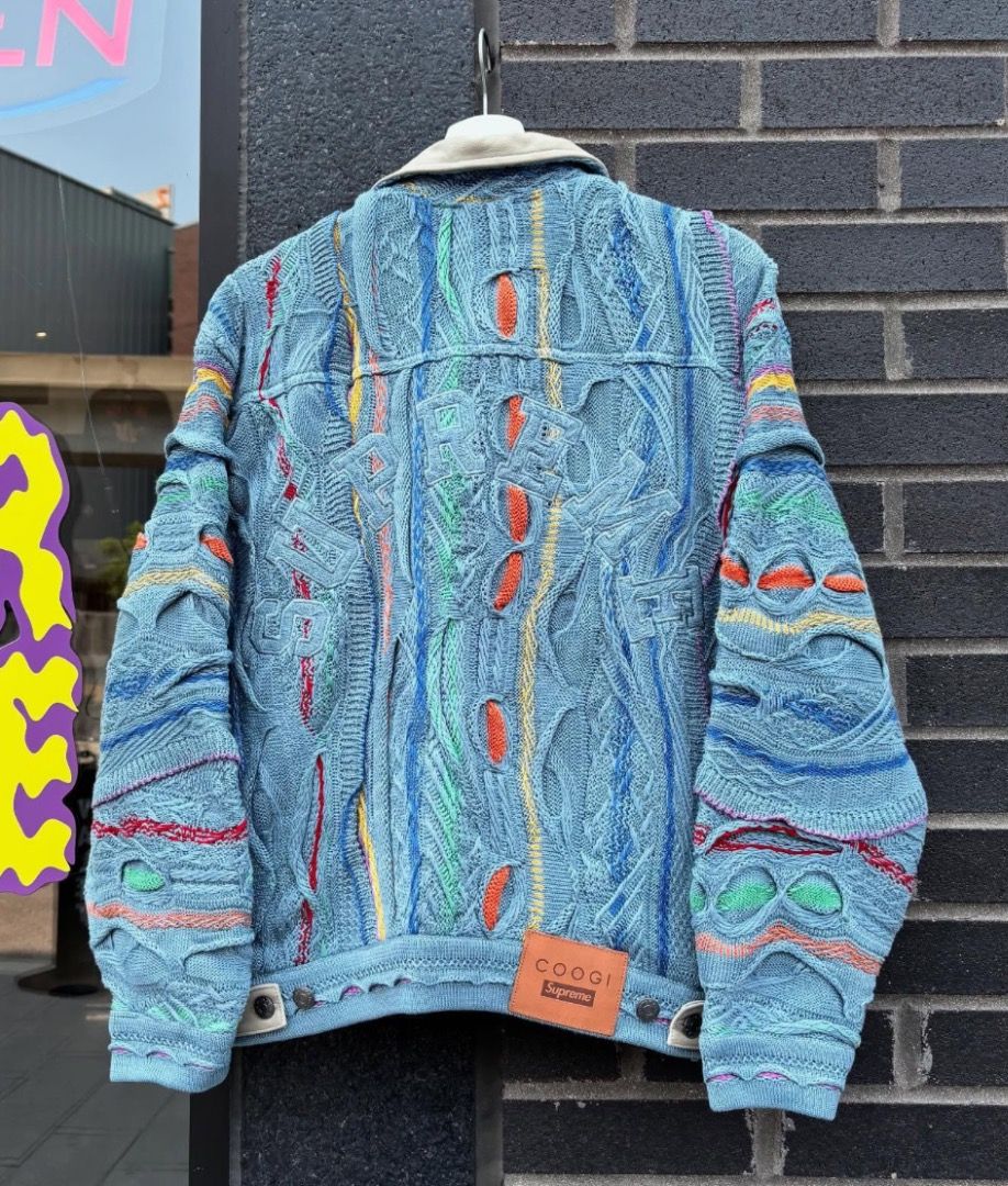 Supreme Coogi Trucker Jacket SS23 (Category: Luxury Apparel) located in San Pablo. Submitted by keentree.e10b73 (Listing ID 1467571008, Image 2). Description: A standout piece from Supreme’s Spring/Summer 2023 collaboration with iconic Australian knitwear brand Coogi (famous for their signature textured, colorful weaves popularized in the '90s). Features: • Cotton knit exterior featuring vibrant multicolor stripes/patterns • Contrast suede collar