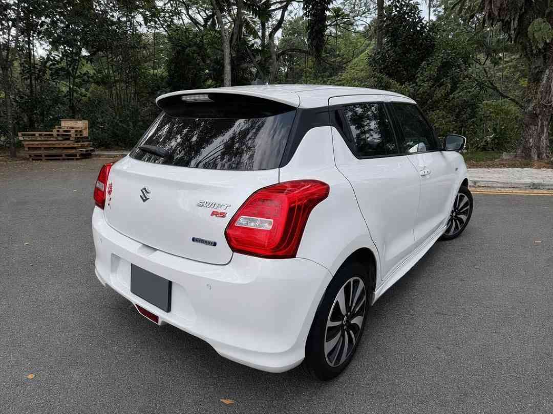Suzuki Swift Mild Hybrid 1.2A RS (Category: Used Cars) located in Singapore. Submitted by carousell_certified_partners (Listing ID 1467533818, Image 3). Description: Rare white unit! Immaculate condition unit! The Suzuki swift mild Hybrid 1.2a RS is a sporty compact hatchback featuring a mild-Hybrid system, a 1.2l engine, and a 6-speed CVT automatic transmission. It's known for fuel efficiency, a comfortable interior with features like a multi-fu