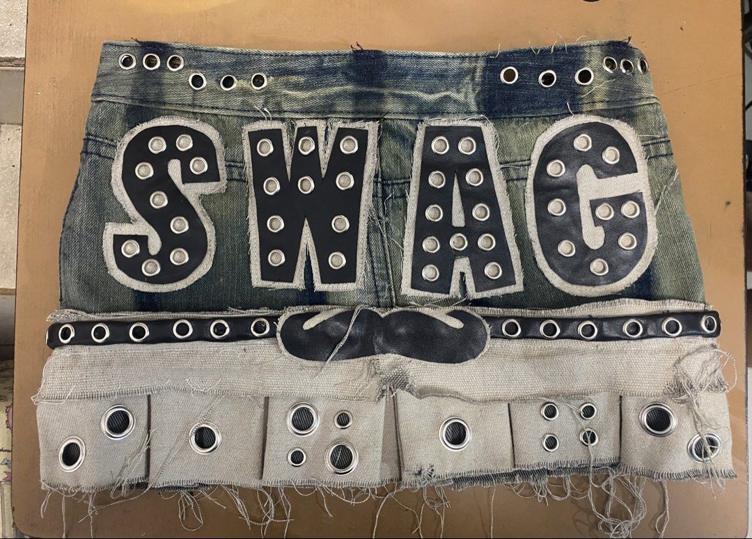 SWAG mini skirt (Category: Skirts) located in Marikina City. Submitted by bebeplumm (Listing ID 1467554935, Image 1). Description: GROMMETS OVERLOAD (customized skirt) Can be worn as low/high rise Adjustable SIZE waist/hips: 32” length: 12” 900+SF DM FOR MORE INFO.