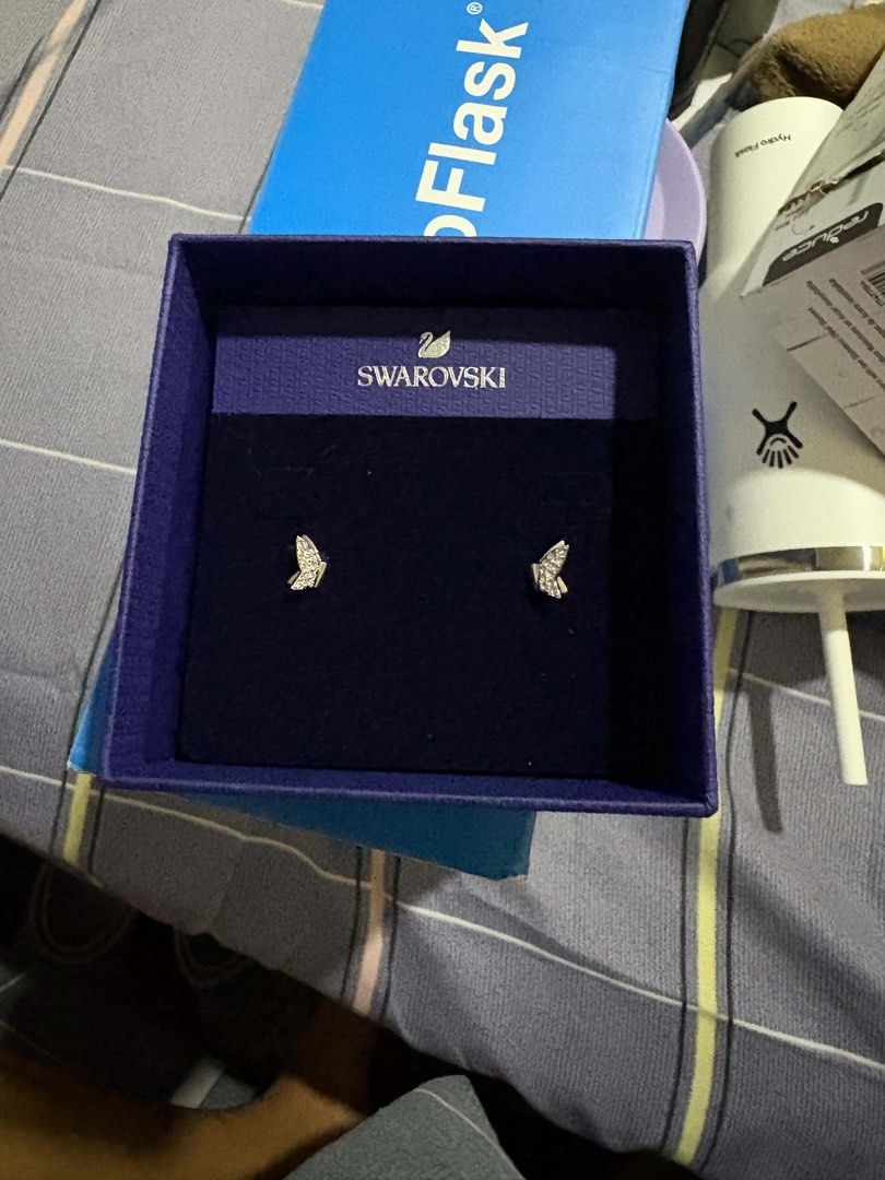 Swarovski Idyllia Lilia stud earrings (Category: Earrings) located in Bacoor. Submitted by michiepeachy (Listing ID 1467516886, Image 2). Description: - Brand: Swarovski - Model Number: 5636424 - Design: Pavé crystal butterfly studs - Finish: Rhodium plated - Condition: Brand new, never worn, clean and undamaged - Inclusions: Original blue box included - Perfect for gifting or daily wear.