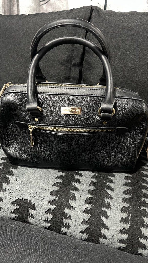 Swiss polo black shoukder bag (Category: Shoulder Bags) located in Baliuag. Submitted by sirc_28 (Listing ID 1467411405, Image 1). Description: This is a Swiss Polo Ladies Top Handle Sling Bag in black, featuring a textured faux leather (PVC leather) finish, twin top handles, gold-tone hardware, and a front zippered pocket.