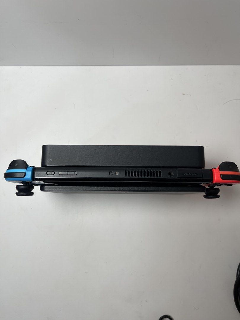Switch OLED Neon Red & Blue 99% Smooth + 3 Bonus Cases & Grips (Category: Nintendo) located in Pasig City. Submitted by tjfindspreloveditems (Listing ID 1467517987, Image 2). Description: 🎮 FOR SALE 🎮 Nintendo Switch OLED Neon Red & Blue 🔴🔵🎮 💰 ₱10,990 fixed 📋 Condition: ✅ 99% smooth ✅ All buttons working ✅ Can connect to eShop ✅ No stick drifts ✅ Tempered glass since day 1 ✅ Used sparingly 📦 Inclusions: • Original Nintendo Adapter • Origi