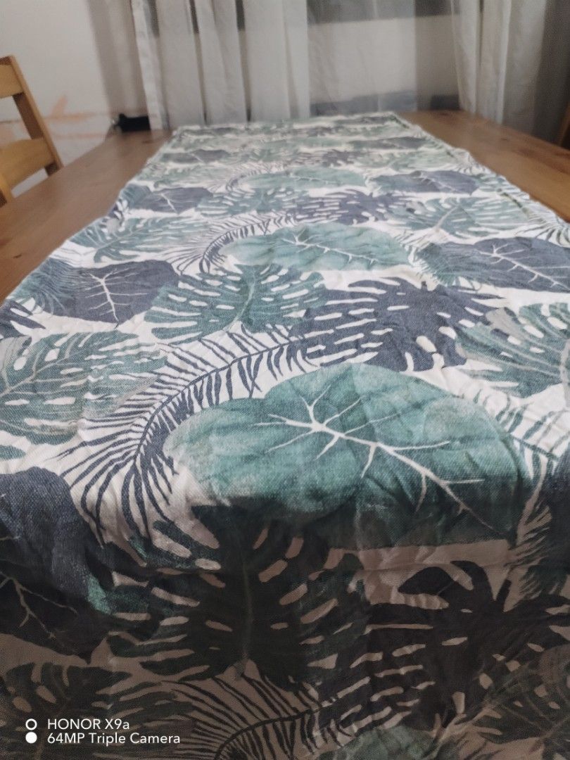Table Runner ( Dahon design) (Category: Towels, Napkins & Holders) located in Muntinlupa City. Submitted by arciagamaryann68 (Listing ID 1467455474, Image 1). Description: - Item: Table Runner - Design: Tropical 'Dahon' (leaf) print - Color: Shades of green and dark grey on white/light background - Condition: Well-maintained and ready to use - Ideal for: Dining table decor, coffee table styling, or home aesthetic upgrade.