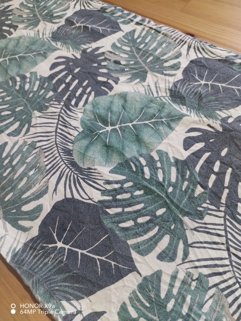 Table Runner ( Dahon design) (Category: Towels, Napkins & Holders) located in Muntinlupa City. Submitted by arciagamaryann68 (Listing ID 1467455474, Image 3). Description: - Item: Table Runner - Design: Tropical 'Dahon' (leaf) print - Color: Shades of green and dark grey on white/light background - Condition: Well-maintained and ready to use - Ideal for: Dining table decor, coffee table styling, or home aesthetic upgrade.