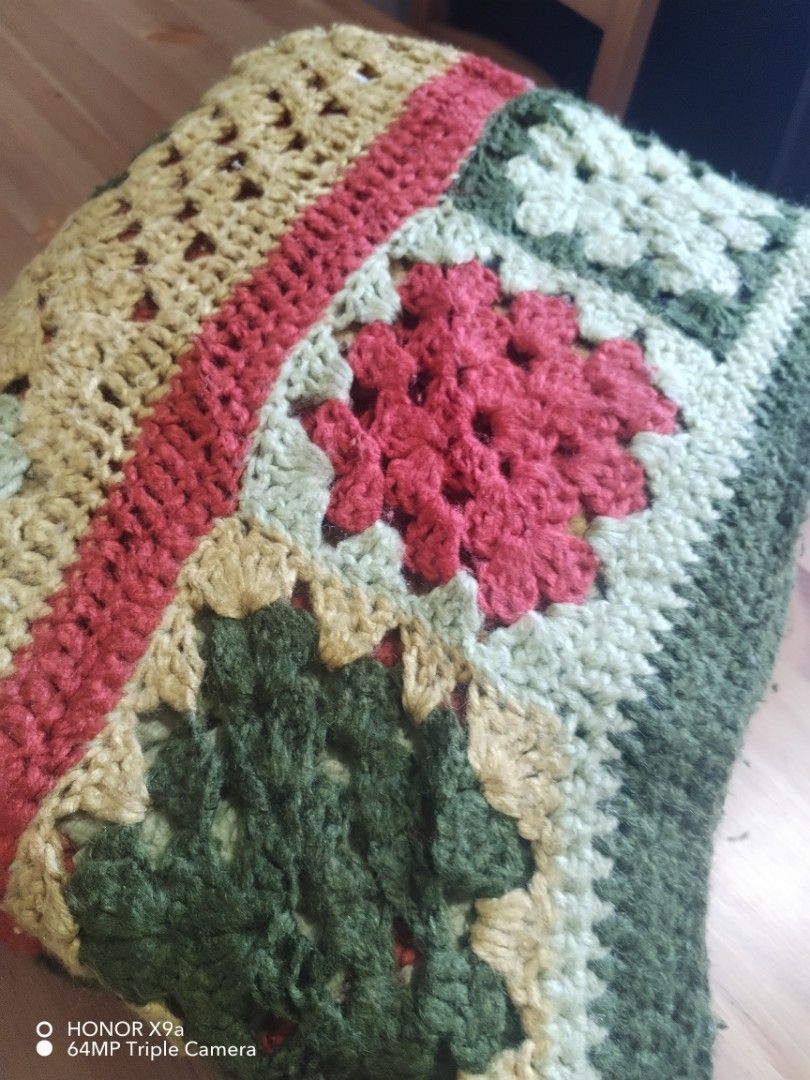 Table Topper ( 62 x92 inches) (Category: Table Linen & Textiles) located in Muntinlupa City. Submitted by arciagamaryann68 (Listing ID 1467421441, Image 2). Description: - Handcrafted crochet table topper featuring a classic granny square pattern - Generous size of 62 x 92 inches, ideal for large tables or as a decorative throw - Beautiful multi-color palette including red, forest green, cream, and yellow - Adds a cozy, rustic, and vintage charm 