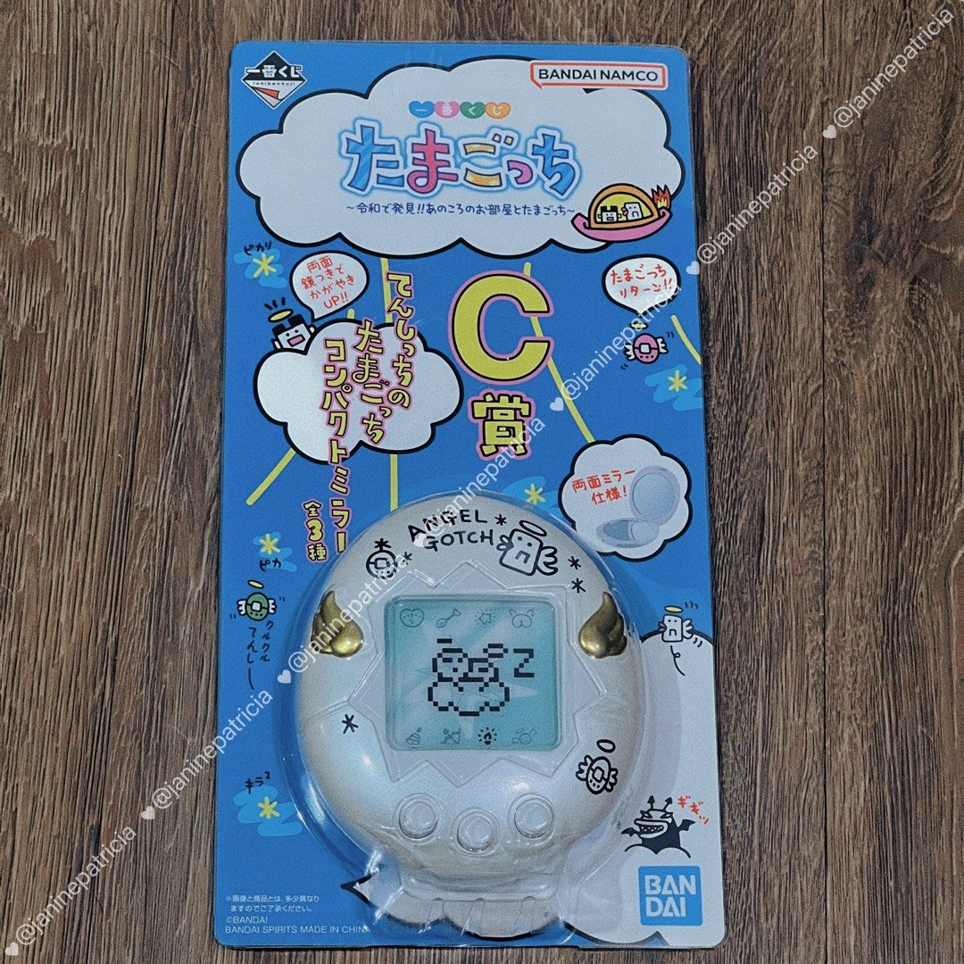 Tamagotchi Angel Gotchi Compact Mirror (Limited Edition) (Category: Character Goods) located in Pasay City. Submitted by janinepatricia (Listing ID 1467406151, Image 1). Description: - Authentic Limited Edition Bandai Namco Ichiban Kuji Tamagotchi item (C Prize - Angel Gotchi compact mirror) - Design: White round case featuring iconic Angel Gotchi graphics and golden wings on the front - Interior: Opens up to dual mirrors - Condition: Brand new-l