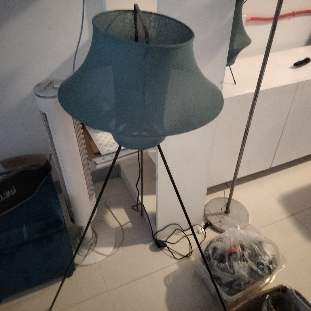 Teal Fabric Tripod Lamp Floor and Table Set (Category: Lighting) located in Valenzuela. Submitted by newbear.425b6e (Listing ID 1467410959, Image 1). Description: - Matching Set: Includes both a tall floor lamp and a smaller table lamp - - Design: Modern teal fabric shades paired with sleek black metal tripod legs - Lighting: Provides soft, cozy diffused lighting for any room - Condition: Fully working with standard plugs, clean fabric with no st