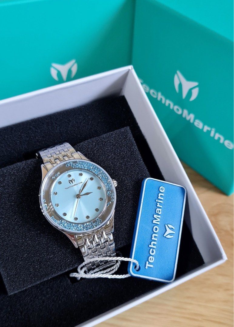 TechnoMarine Brillantezza Del Mare (Category: Women's Watches) located in Caloocan City. Submitted by mode.manila (Listing ID 1467372832, Image 3). Description: - 34mm - Brand: TechnoMarine - Condition: Brand new, never worn, pristine condition - Dial: Light blue with floating blue crystals around the bezel - Strap: Silver-tone metal bracelet - Movement: Quartz movement with analog display - Inclusions: Original branded box and hang tag included.