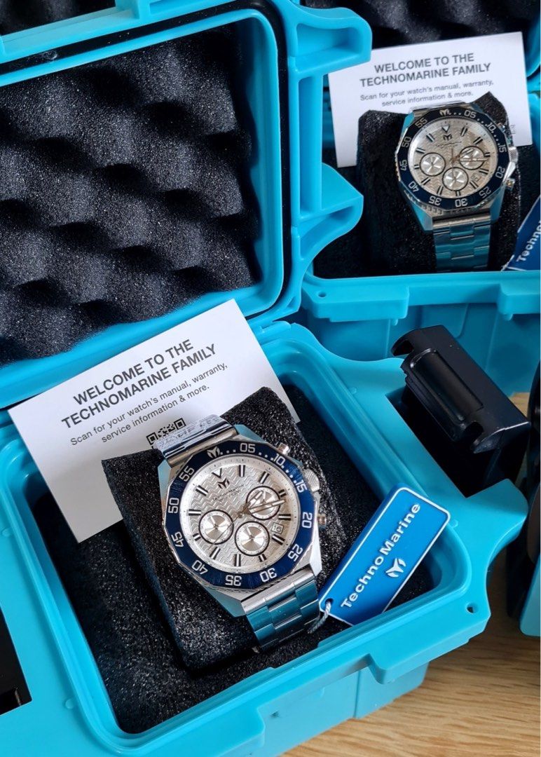TechnoMarine Chronograph Watch Silver Blue Dial Steel (Category: Men's Watches) located in Caloocan City. Submitted by mode.manila (Listing ID 1467372559, Image 3). Description: - Brand: TechnoMarine Chronograph Watch - Condition: Brand new, still wrapped in protective plastic film - Dial: Silver wave-pattern with multiple subdials and date window at 4 o'clock - Bezel: Striking blue rotating bezel - Material: Durable stainless steel case and brac