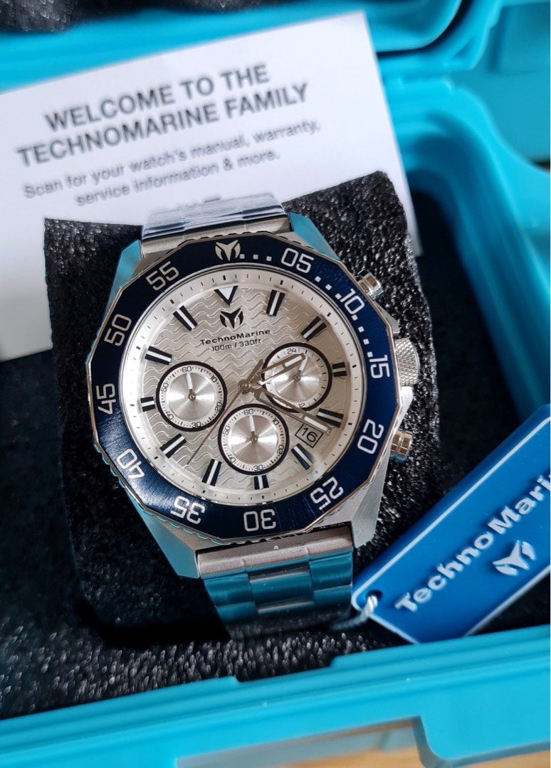 TechnoMarine Chronograph Watch Silver Blue Dial Steel (Category: Men's Watches) located in Caloocan City. Submitted by mode.manila (Listing ID 1467372559, Image 1). Description: - Brand: TechnoMarine Chronograph Watch - Condition: Brand new, still wrapped in protective plastic film - Dial: Silver wave-pattern with multiple subdials and date window at 4 o'clock - Bezel: Striking blue rotating bezel - Material: Durable stainless steel case and brac