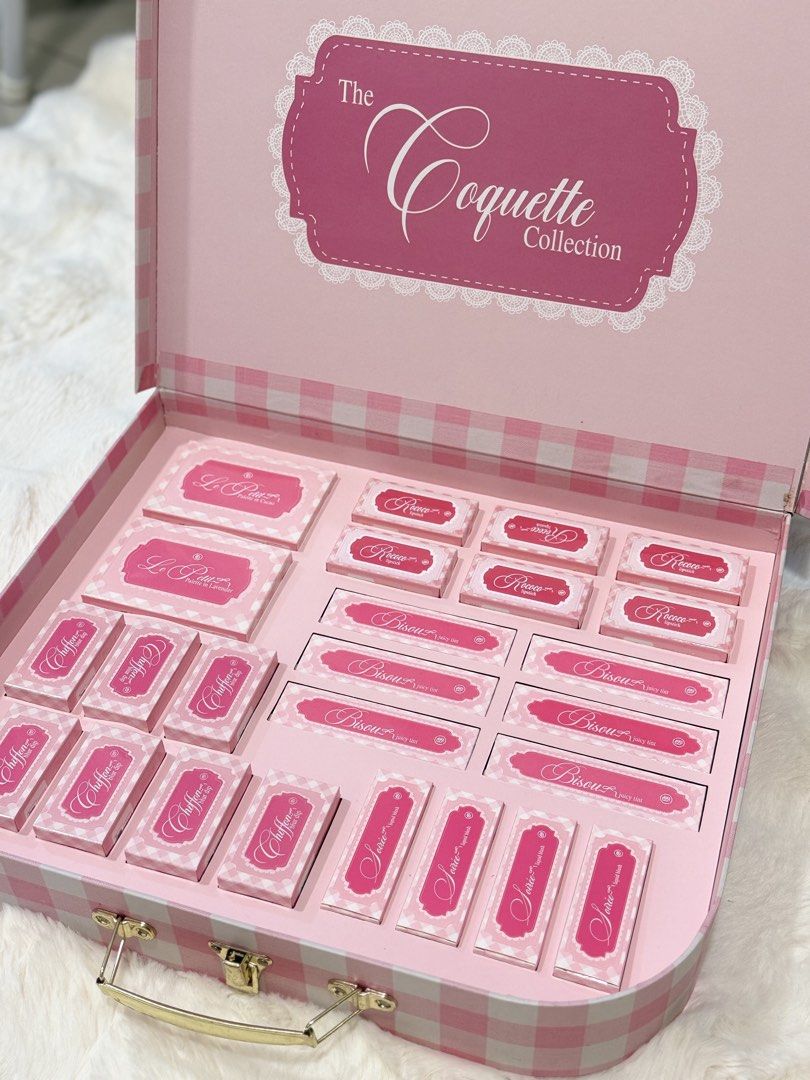 The Coquette Collection Makeup Set (Category: Makeup) located in Manila. Submitted by preshyyyyy_ (Listing ID 1467567718, Image 1). Description: - Complete Coquette Collection makeup set in a large pink checkered suitcase box - Includes Chiffon Blur Dip pots with applicators, Rococo lipsticks, Bisou juicy tints, and eyeshadow palettes - Full set with all matching boxes included inside - 100% brand new and unused - Neatly arranged in its original 