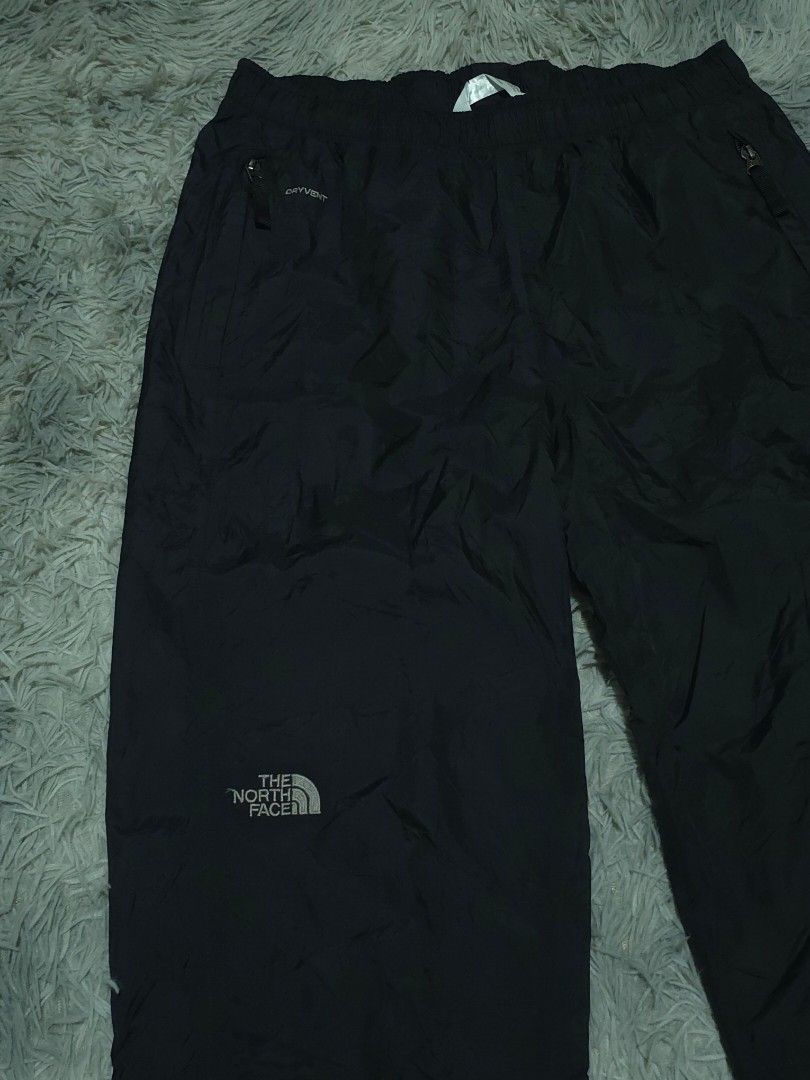 The North Face DryVent Black Waterproof Pants (Category: Trousers) located in Abulug. Submitted by humanwhosellthings (Listing ID 1467365649, Image 2). Description: Black waterproof pants from The North Face. DryVent technology fabric keeps moisture out. Elastic waistband for an easy fit, plus zippered pockets to secure your small items. Subtle branding embroidery on the leg. Great choice for outdoor hikes or rainy weather. ✅Excellent Condition ✅
