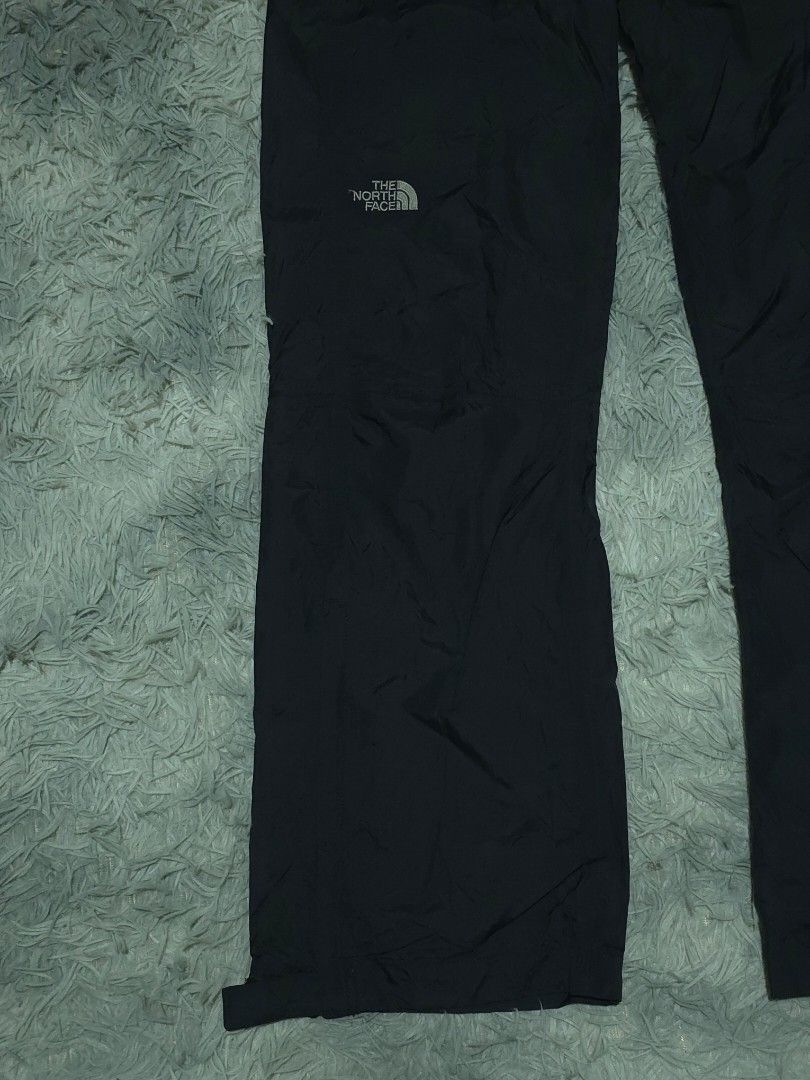 The North Face DryVent Black Waterproof Pants (Category: Trousers) located in Abulug. Submitted by humanwhosellthings (Listing ID 1467365649, Image 3). Description: Black waterproof pants from The North Face. DryVent technology fabric keeps moisture out. Elastic waistband for an easy fit, plus zippered pockets to secure your small items. Subtle branding embroidery on the leg. Great choice for outdoor hikes or rainy weather. ✅Excellent Condition ✅