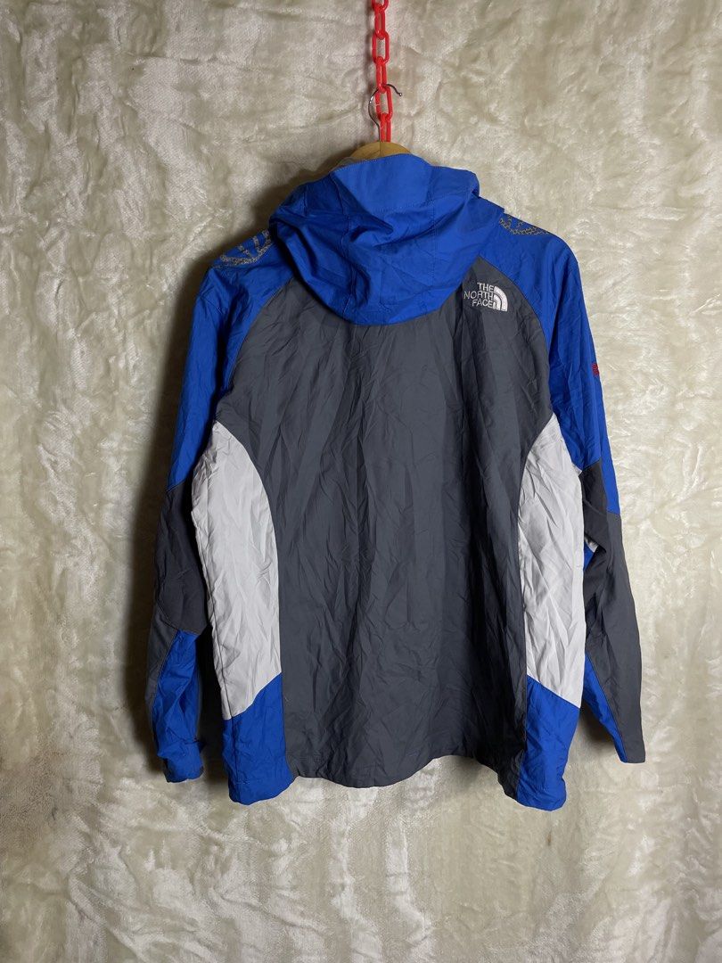 The North Face Summit Series Windstopper Jacket (Category: Coats, Jackets and Outerwear) located in Molave. Submitted by charlesthrifter (Listing ID 1467366573, Image 2). Description: - Brand: The North Face Summit Series - Design: Stylish blue, grey, and white colorblock - Material: Windstopper fabric on sleeves to block out cold wind - Features: Attached hood, full front zipper, and secure zipped side pockets - Size: Tagged size 100 - Condition